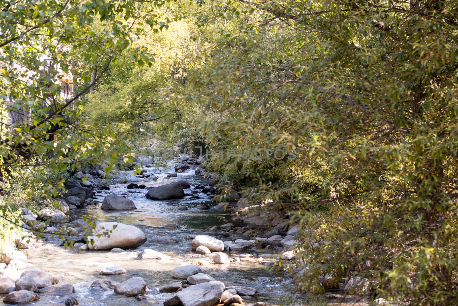 Sunny day in the VAlira River in the city of Encamp in Andorra in summer 2020.