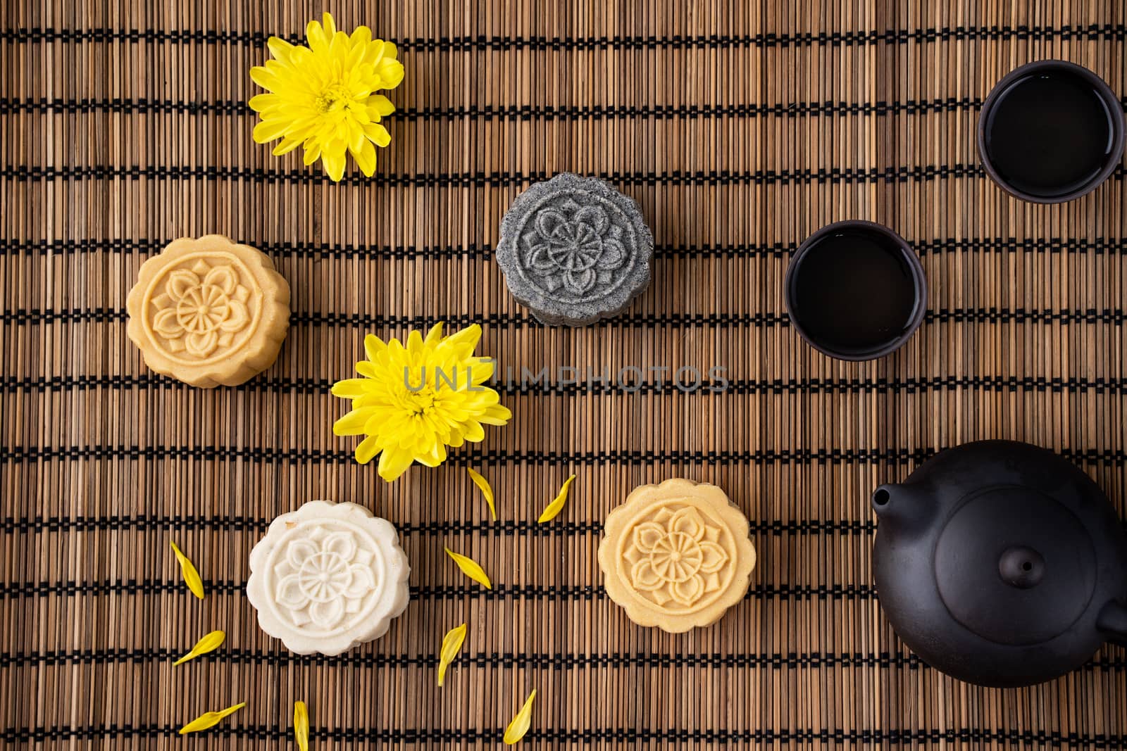 Colorful beautiful moon cake, mung bean cake, Champion Scholar Pastry cake for Mid-Autumn festival traditional gourmet dessert snack, top view, flat lay.