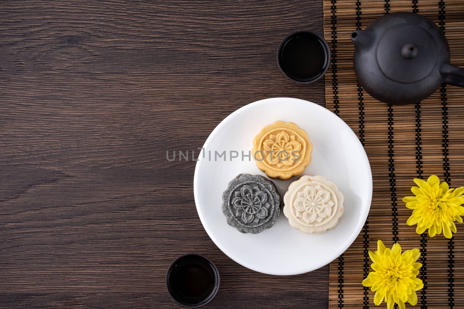 Colorful beautiful moon cake, mung bean cake, Champion Scholar Pastry cake for Mid-Autumn festival traditional gourmet dessert snack, top view, flat lay.