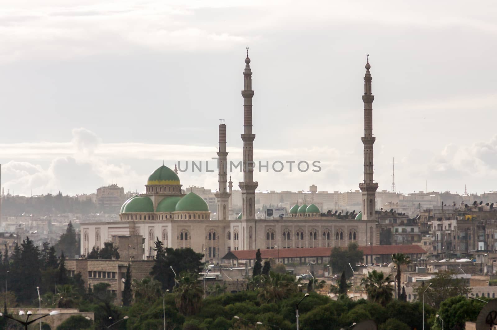 Mosque with minarets and green domes in centre of Aleppo Syria before the war by kgboxford