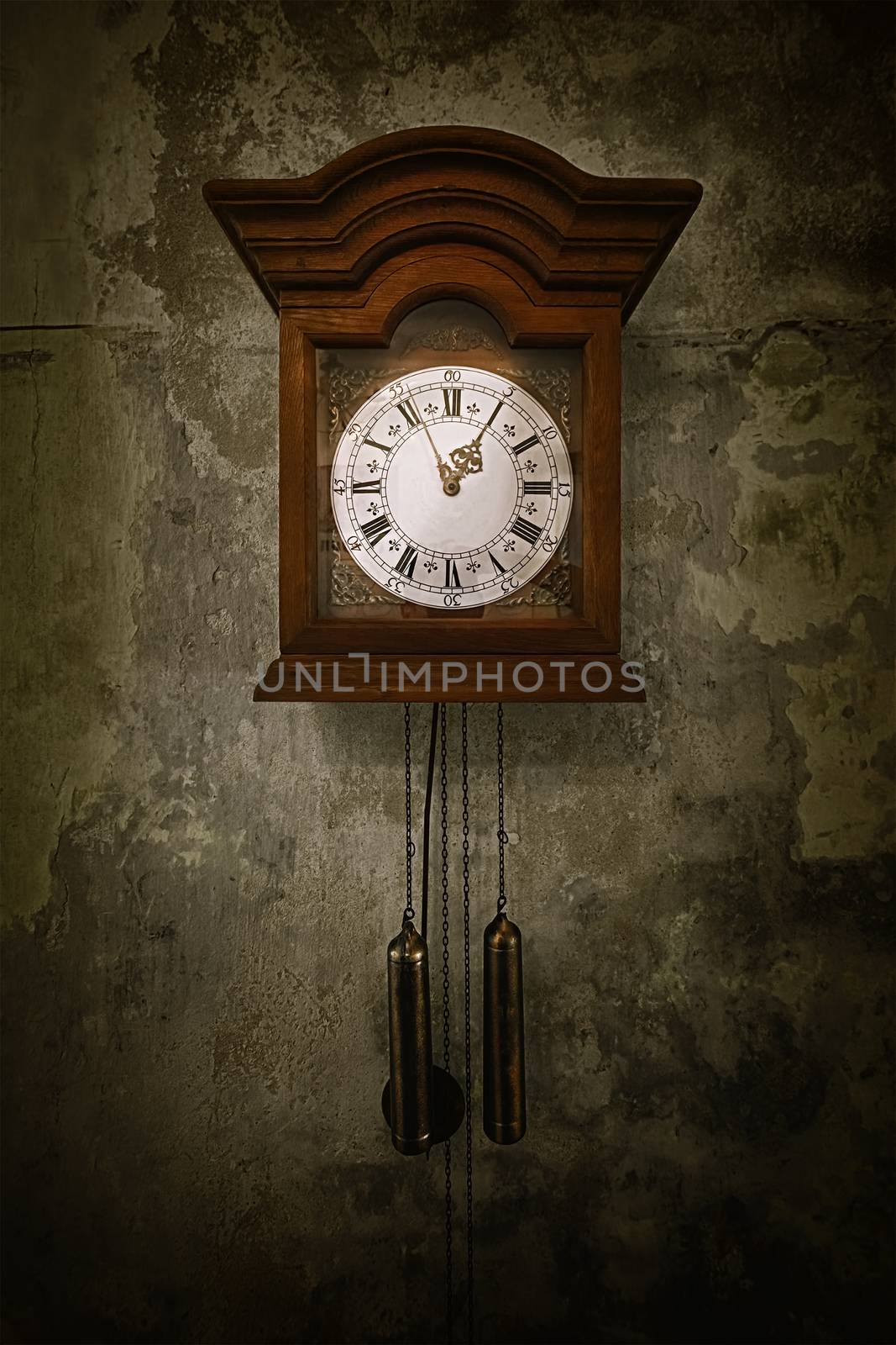 Old clock on the wall in an abandonet palace