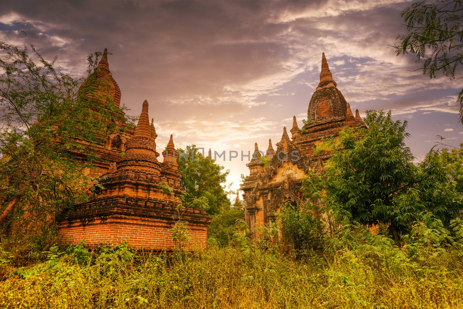 Pagodas and temples of Bagan world heritage site at sunset