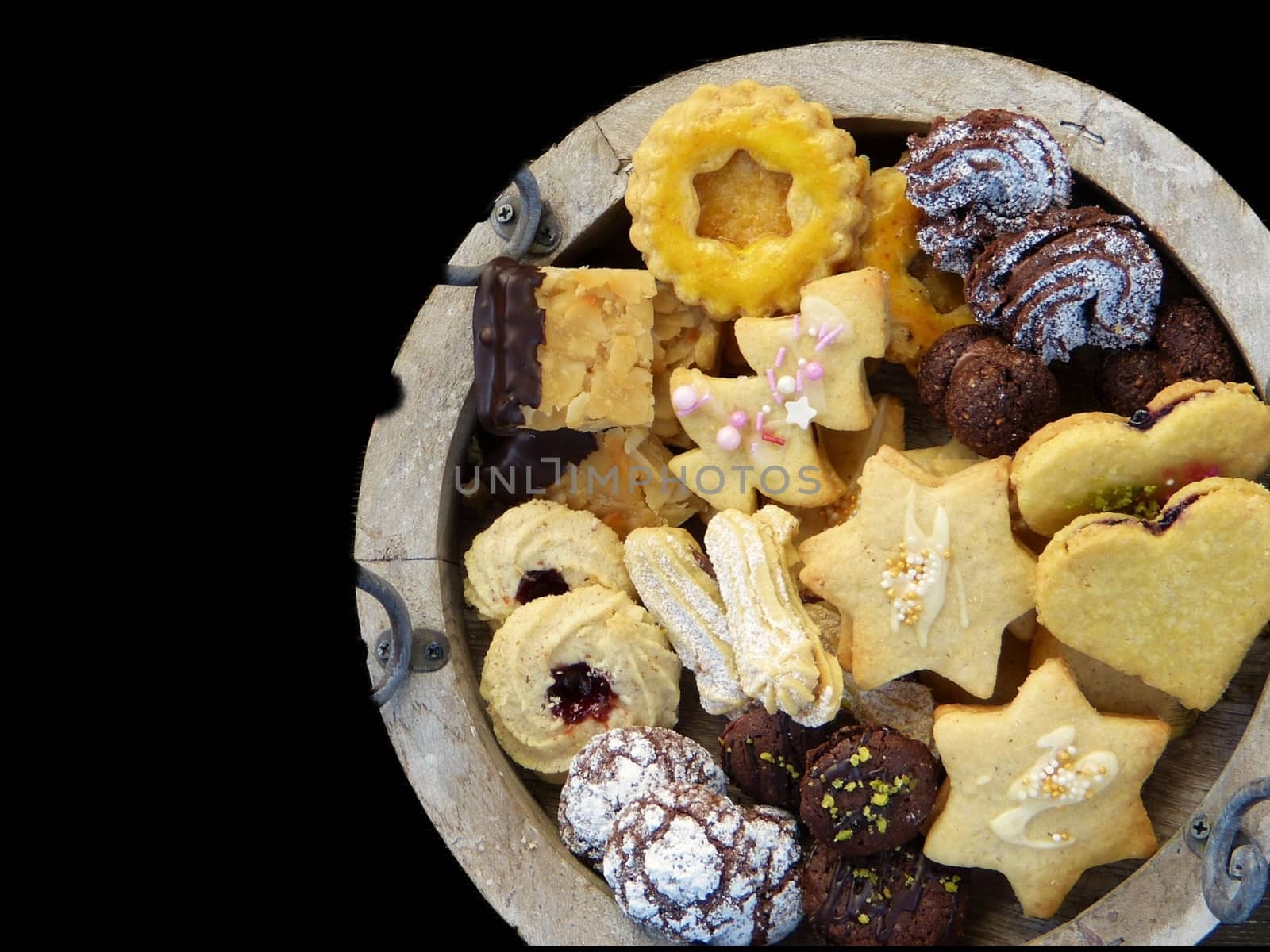 Christmas sweet biscuits in a variety of flavours with black background.