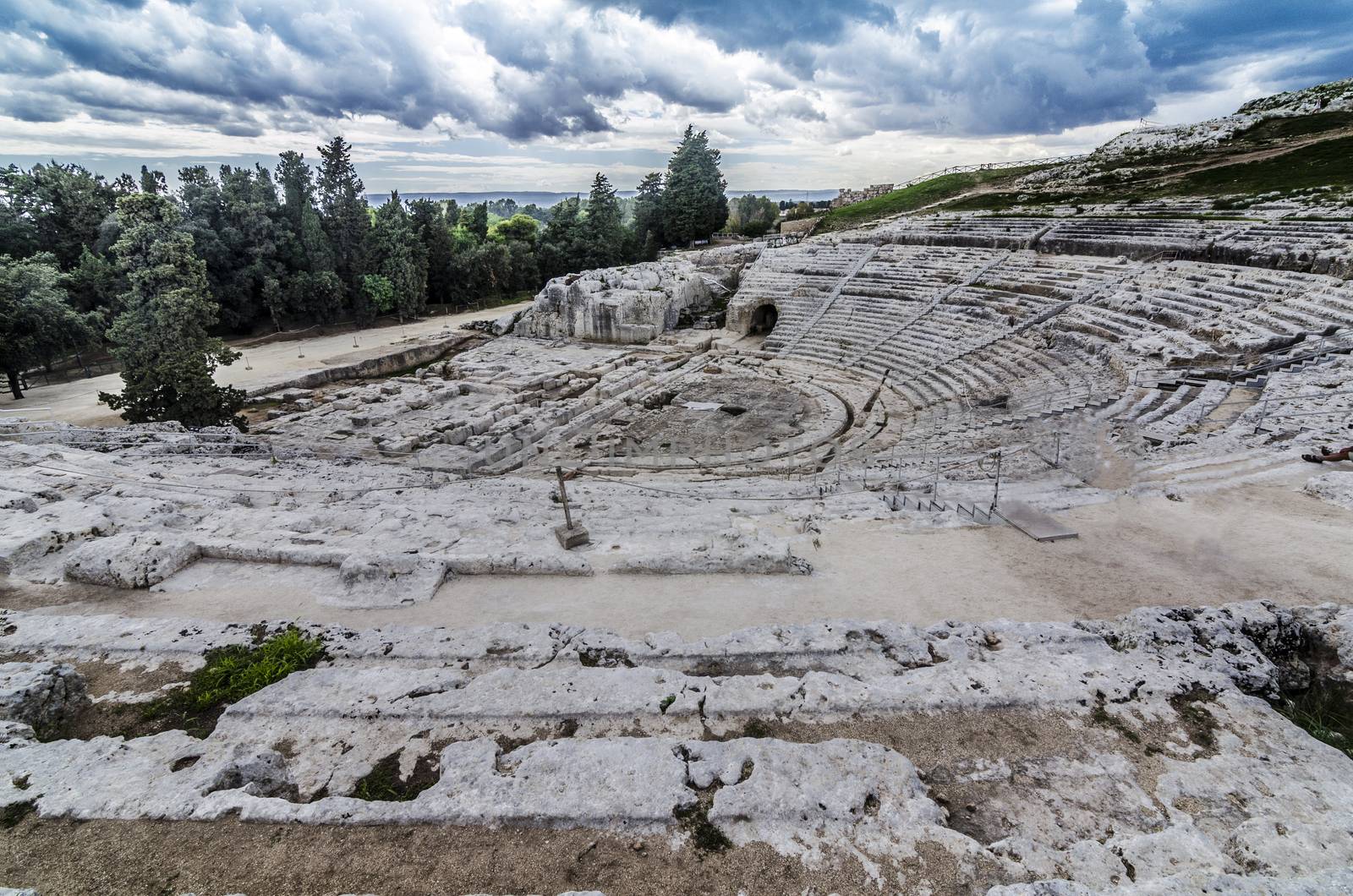 Panoramic view and detail of the ancient and historic roman amphitheater of syracuse on the island of sicily italy