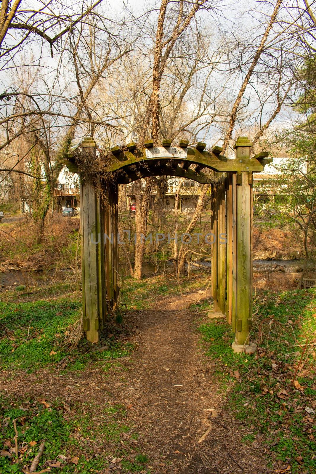A Garden Arch in the woods of a park in Suburban Pennsylvania by bju12290