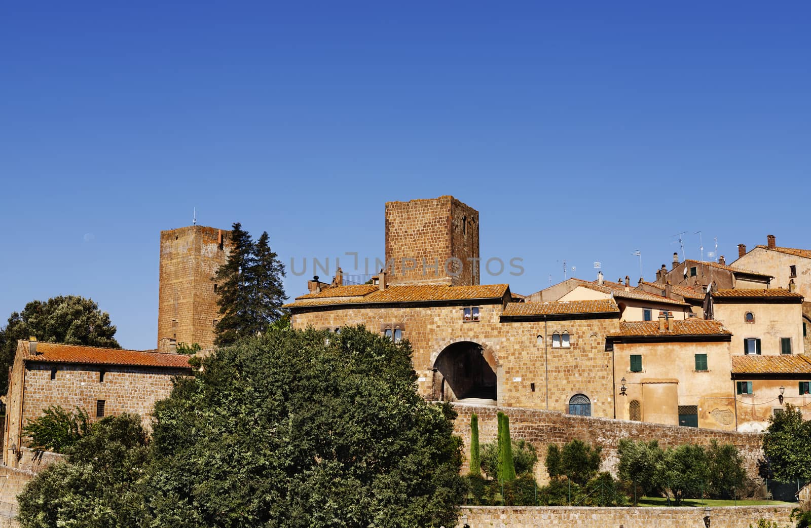 TUSCANIA-ITALY-August 2020 -view of the fortified etruscan city of Tuscania with beautiful walls , and tower