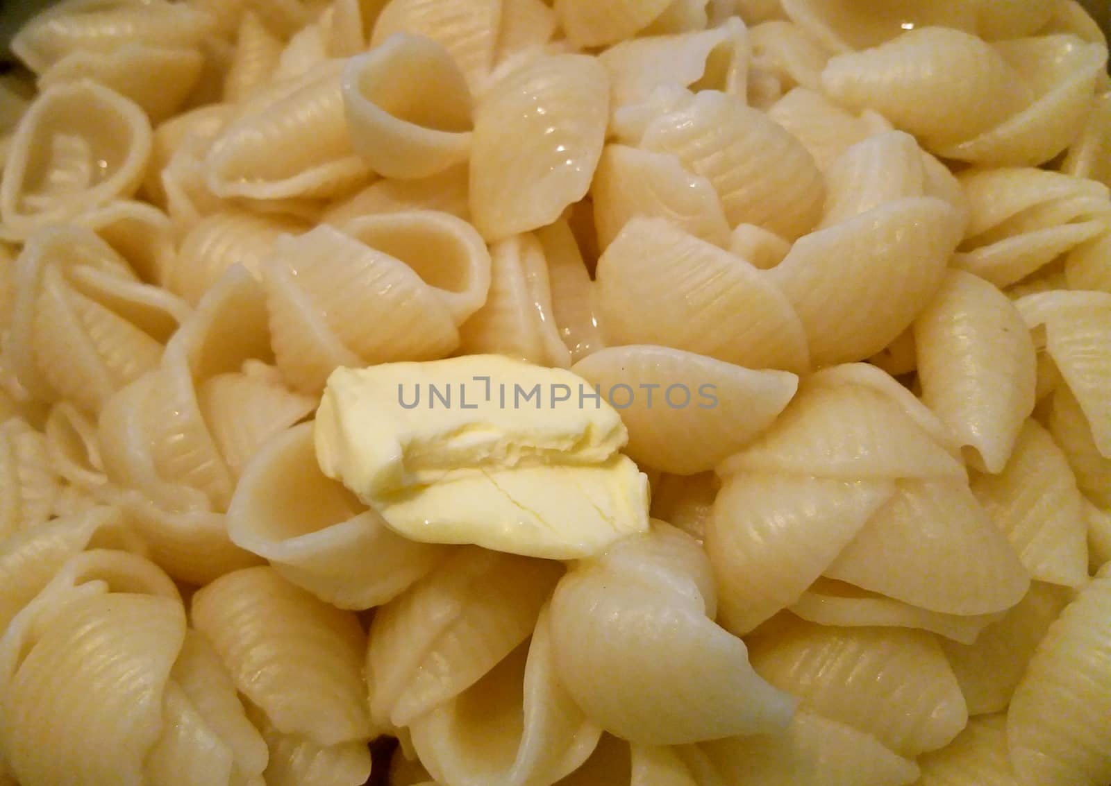 Preparing pasta, mix them with butter after boiling