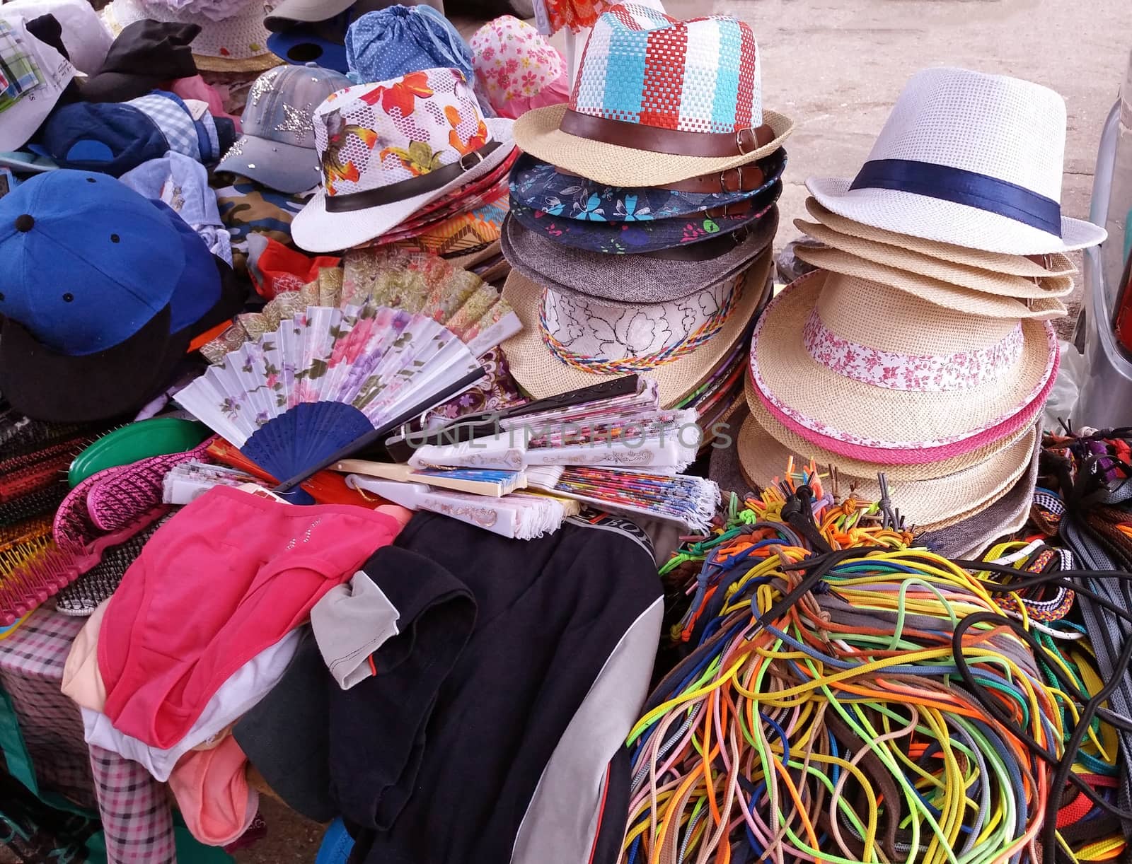 Summer hats and other women's clothes in the market