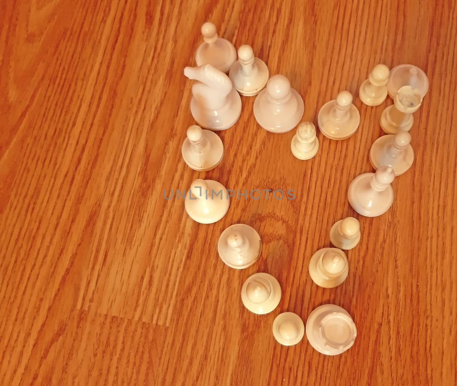 White chess Pieces Arranged in Shape of Heart