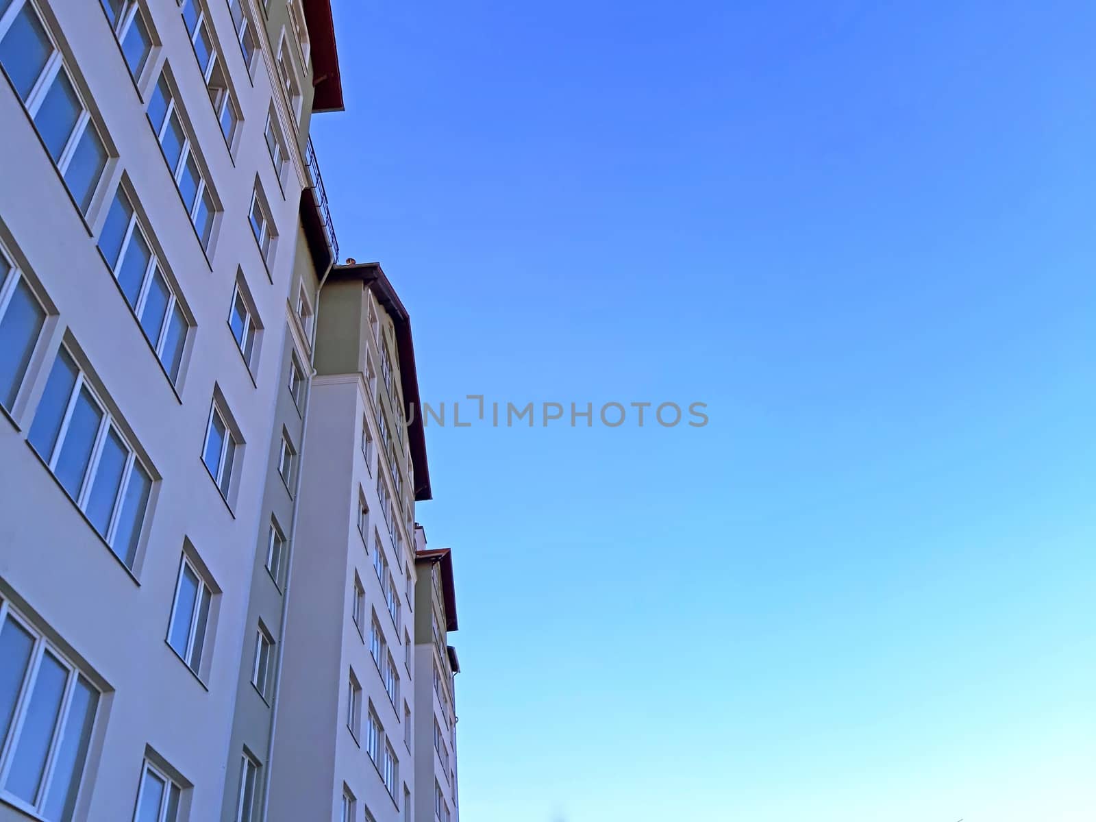 Building on clear blue sky. Copy space by Mindru