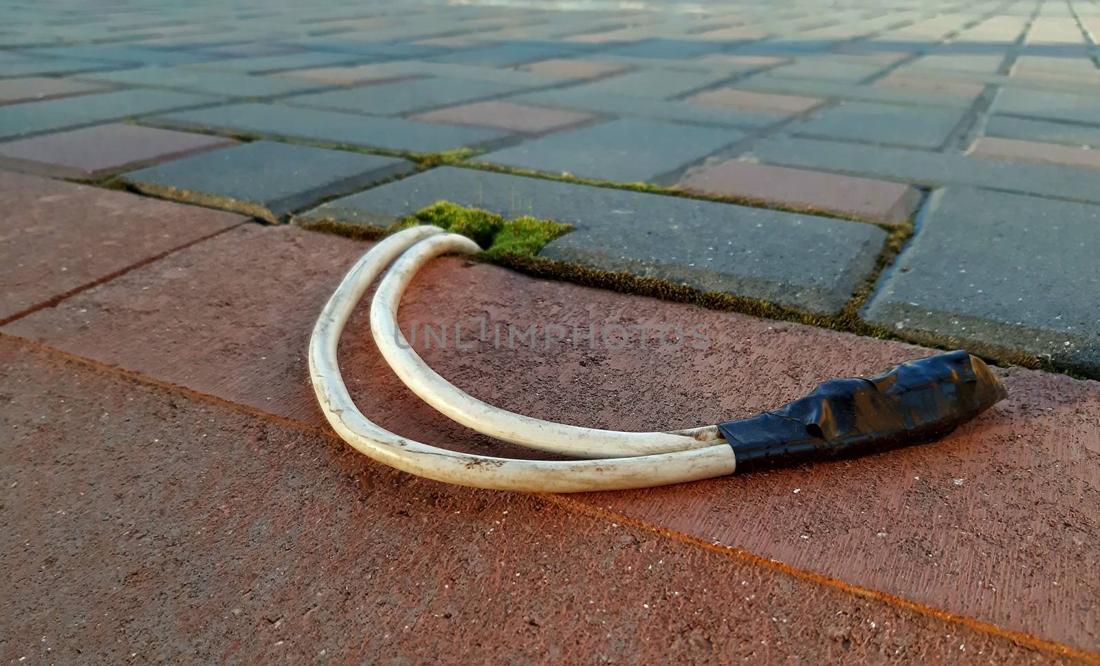 Electric cable installed under pavement, light installation concept.