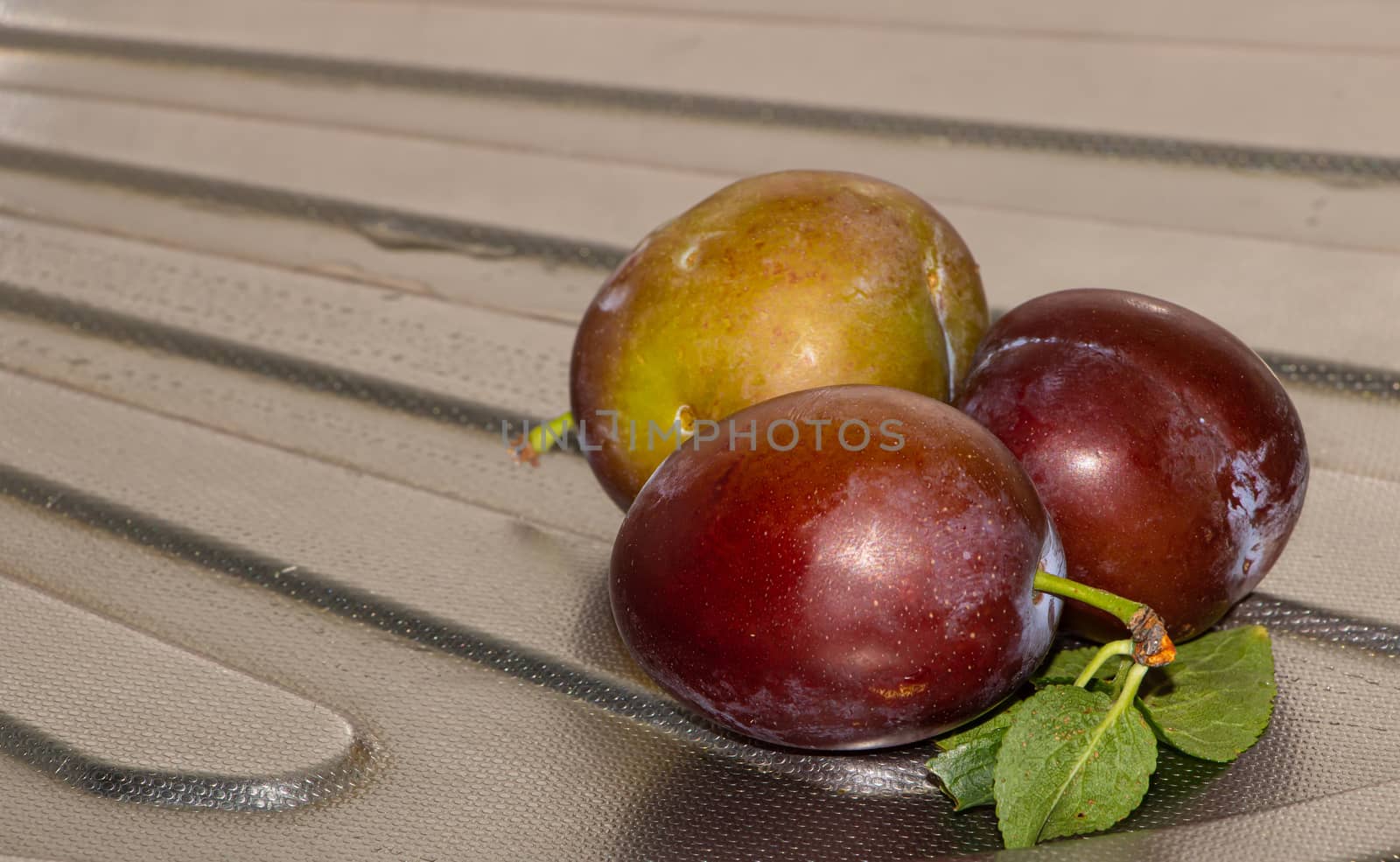 Some fresh plums in the kitchen close up.