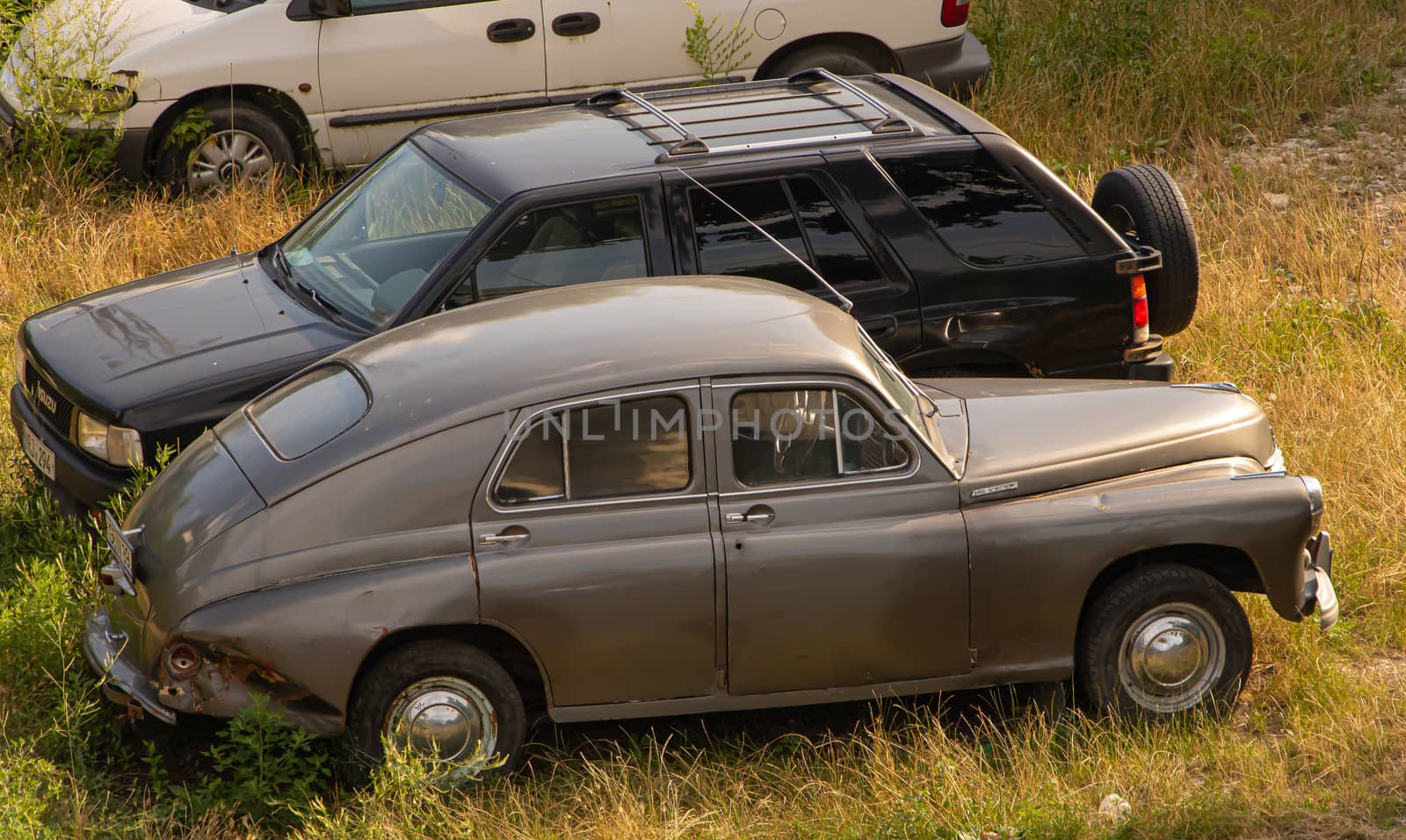 Chisinau, Moldova - July 14 2019. An old car parked next to a new one