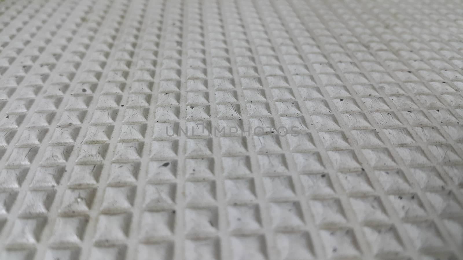closeup view of grey color beautiful 3D geometric shapes of floor tiles by Photochowk