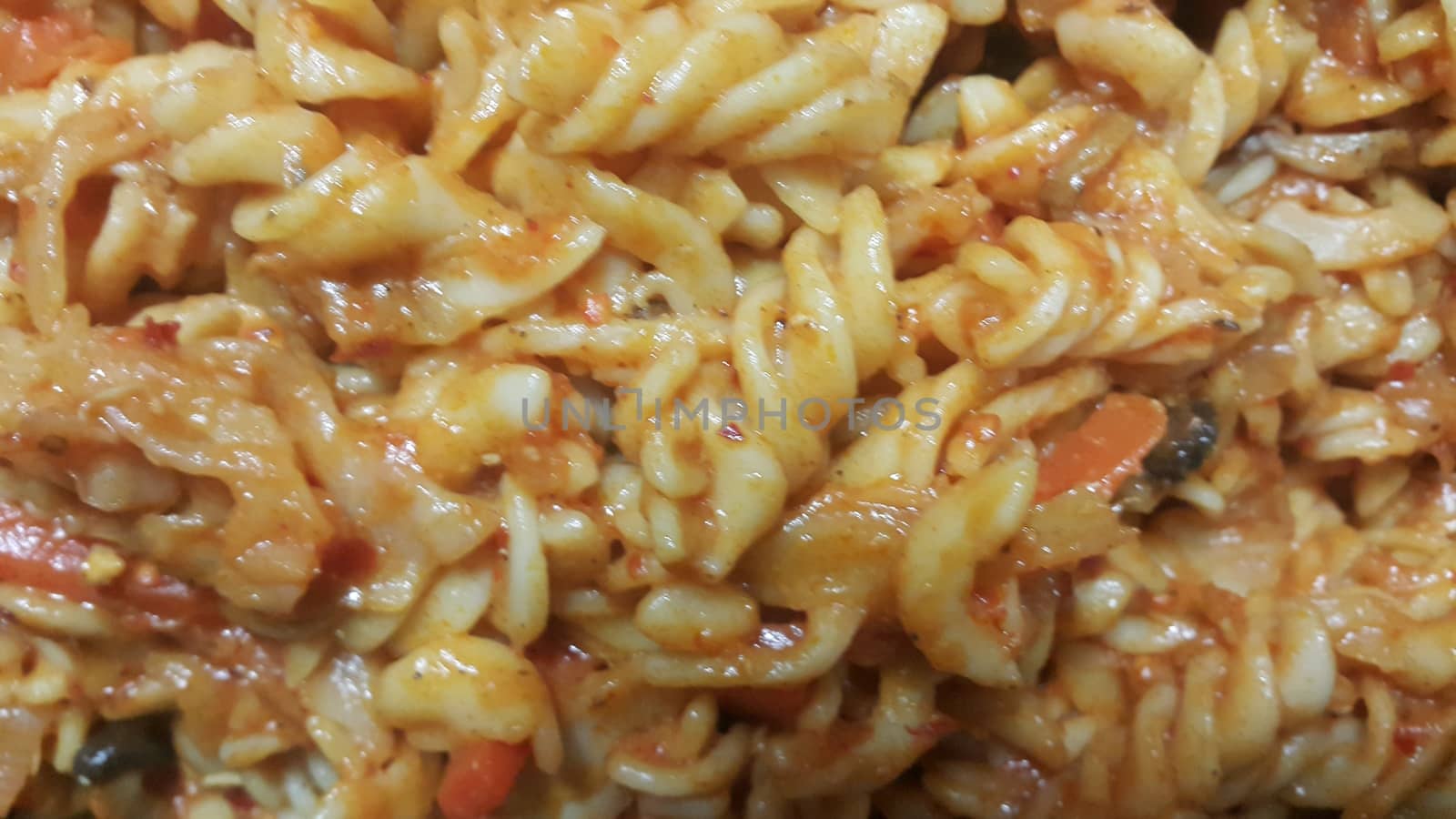 Close up view of delicious home made pasta dish with spaghetti and parsley.