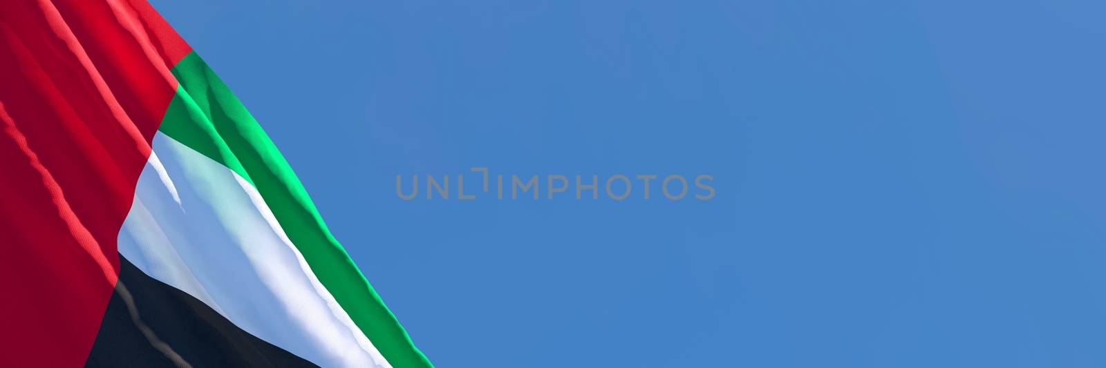 3D rendering of the national flag of UAE waving in the wind against a blue sky