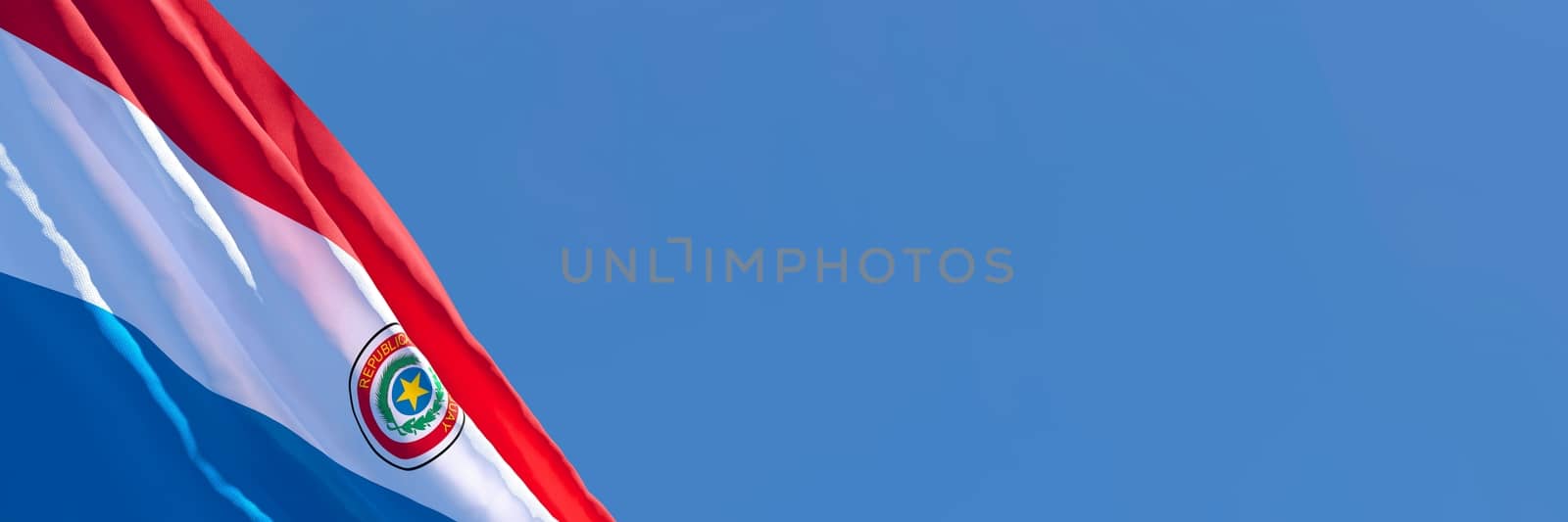 3D rendering of the national flag of Paraguay waving in the wind against a blue sky