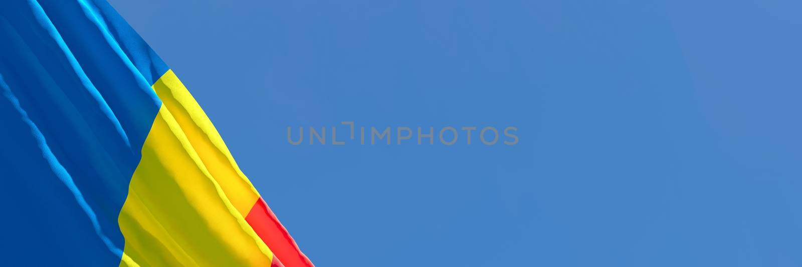 3D rendering of the national flag of Romania waving in the wind against a blue sky