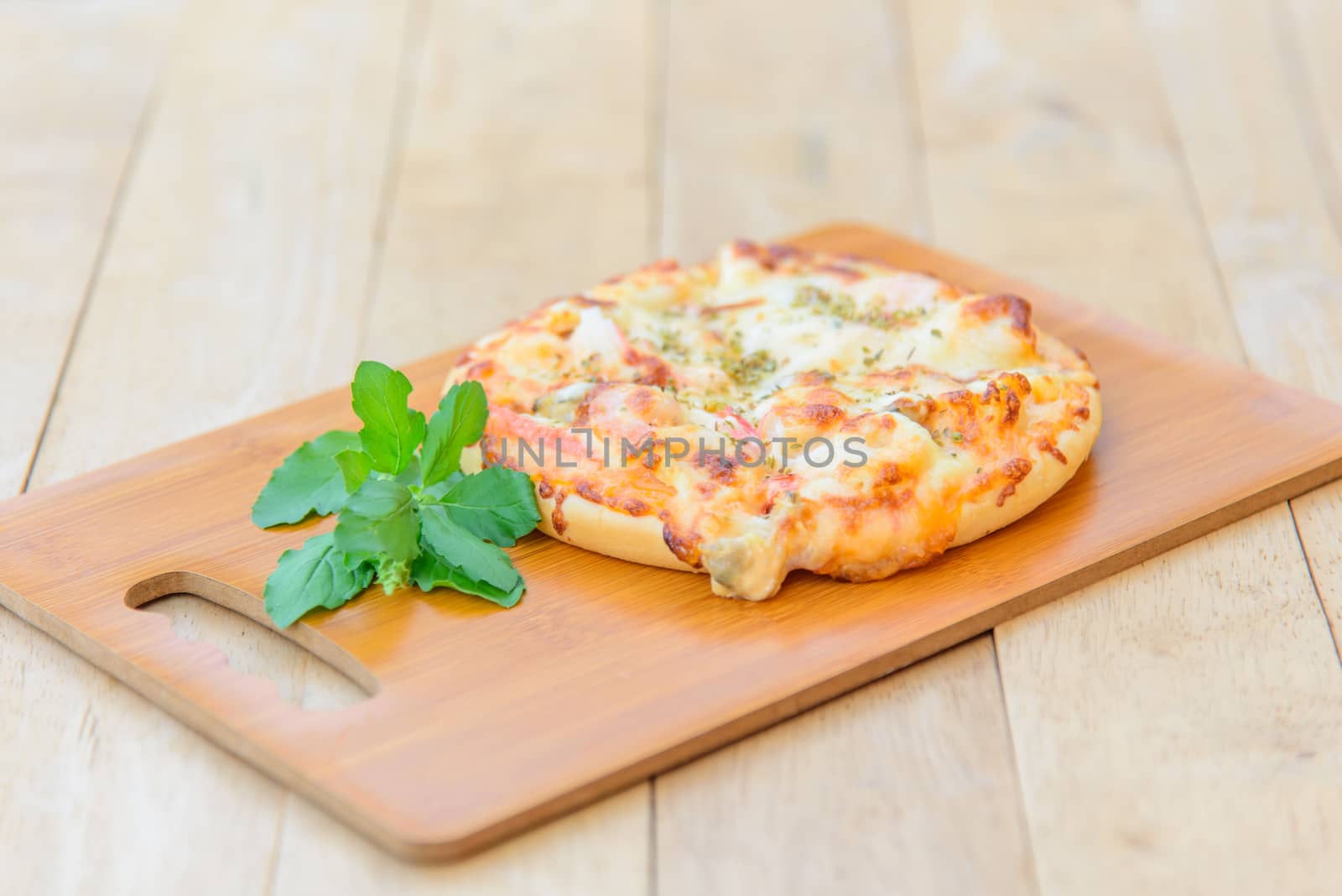 pizza Hawaiian Home made on wood plate