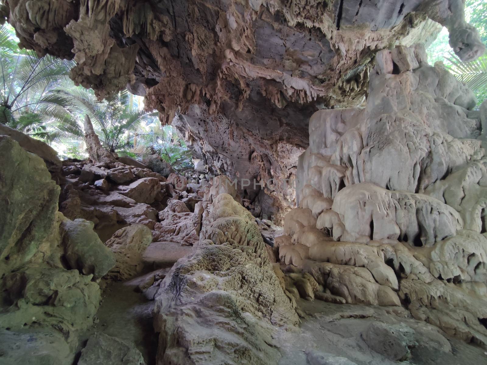 Horizontal photo of cave with stalactites and stalagmites in Thailand