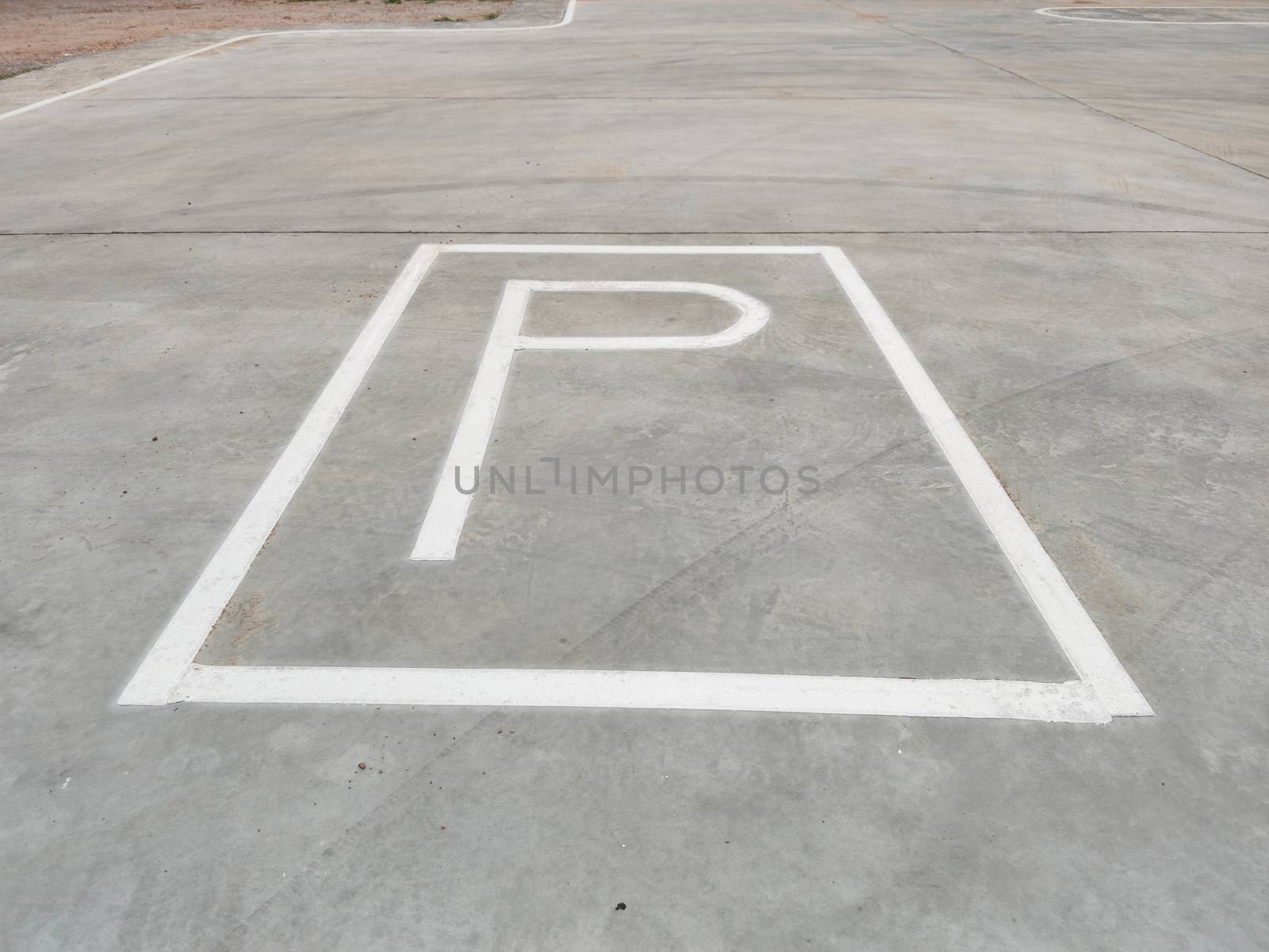 White parking sign on the ground without any arrow for directions in Thailand