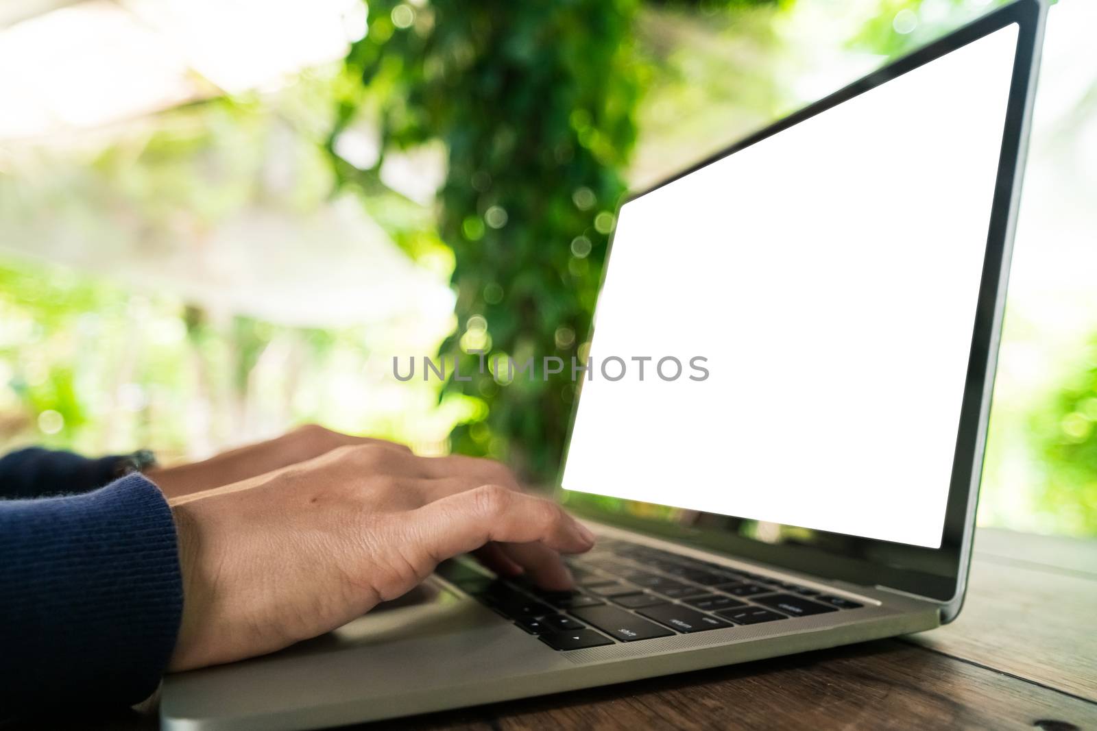 Woman using laptop and smartphone to work study in vacation day at resort room background.