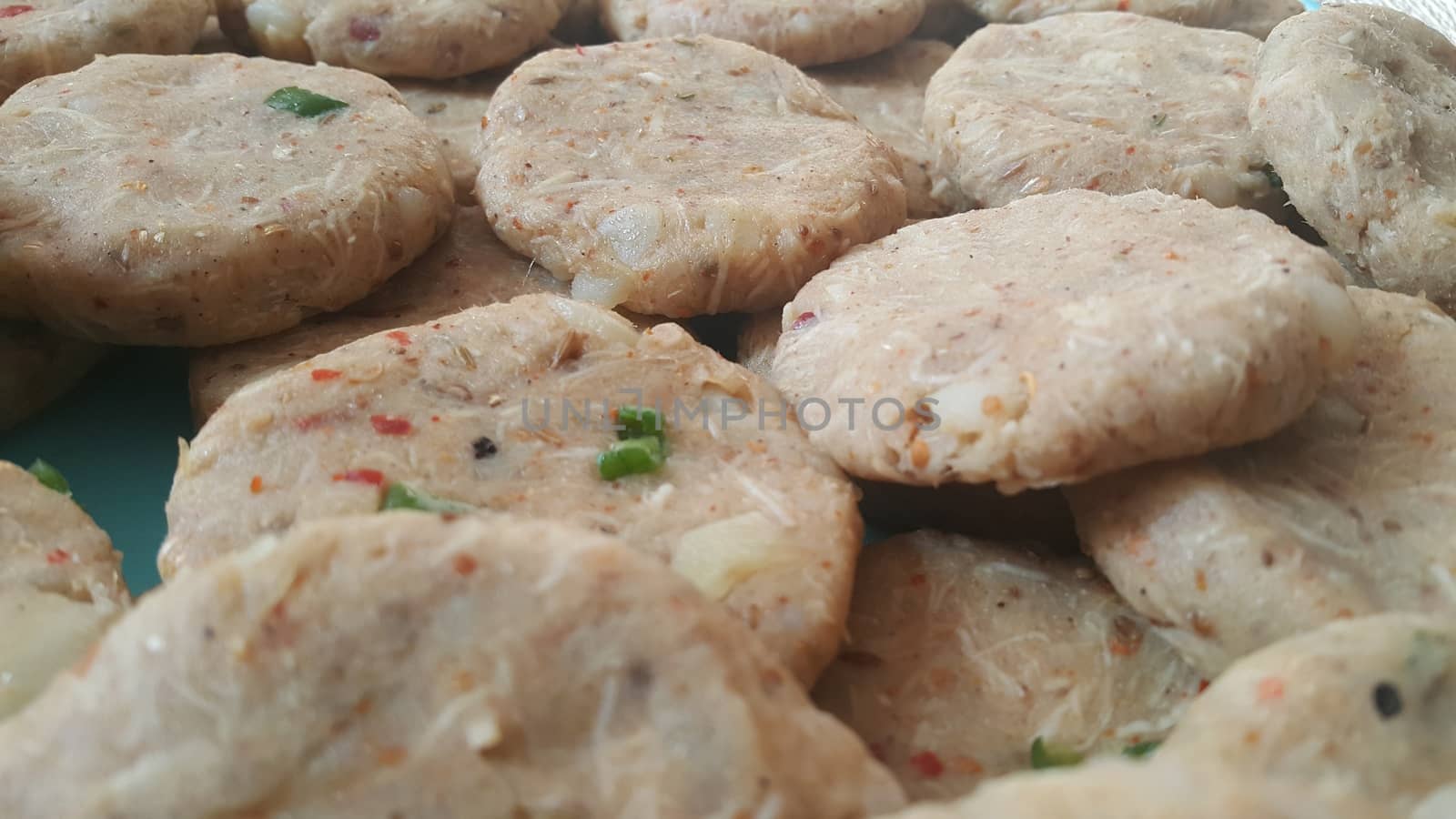 Spicy and tasty uncooked kebab stuffed with minced meat, onion,  alo paste and chana. Asian spicy cuisine.