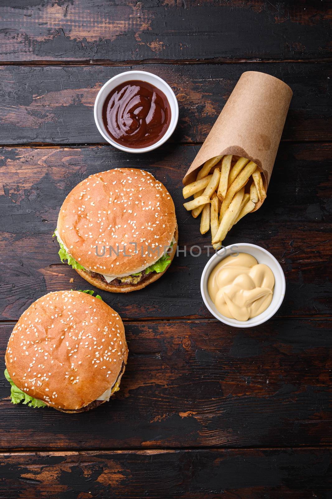 Grilled home made burger with beef on dark wooden background, topview by Ilianesolenyi