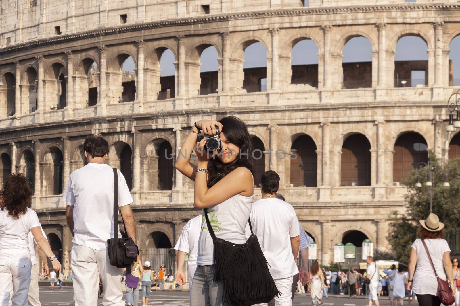 Rome, Italy - June 27, 2010: A girl takes pictures in Rome by alvarobueno