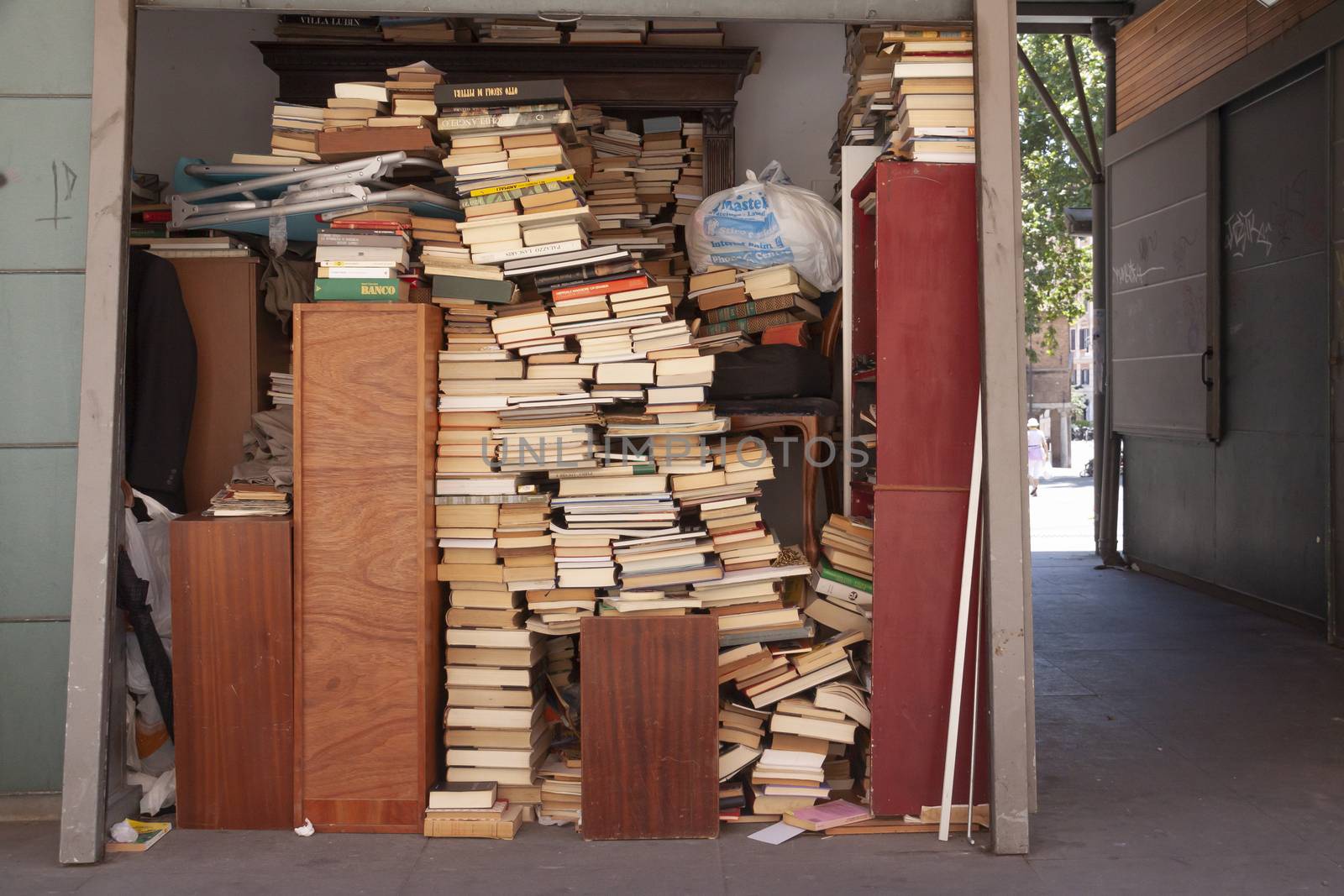 Rome, Italy - June 28, 2010: Stacks of old books at a street stall in the center of Rome.