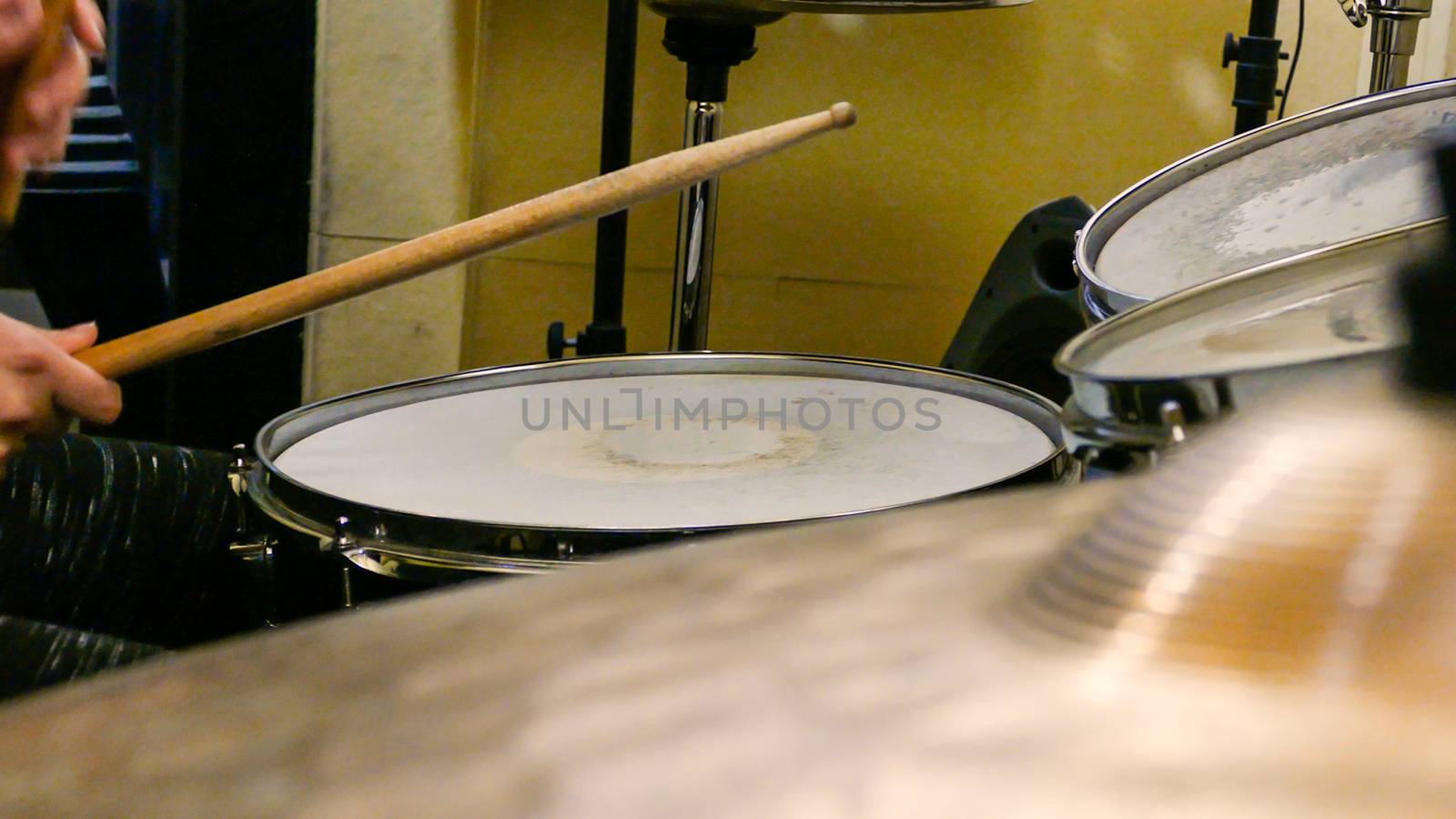 Playing drums on drum kit by imagesbykenny