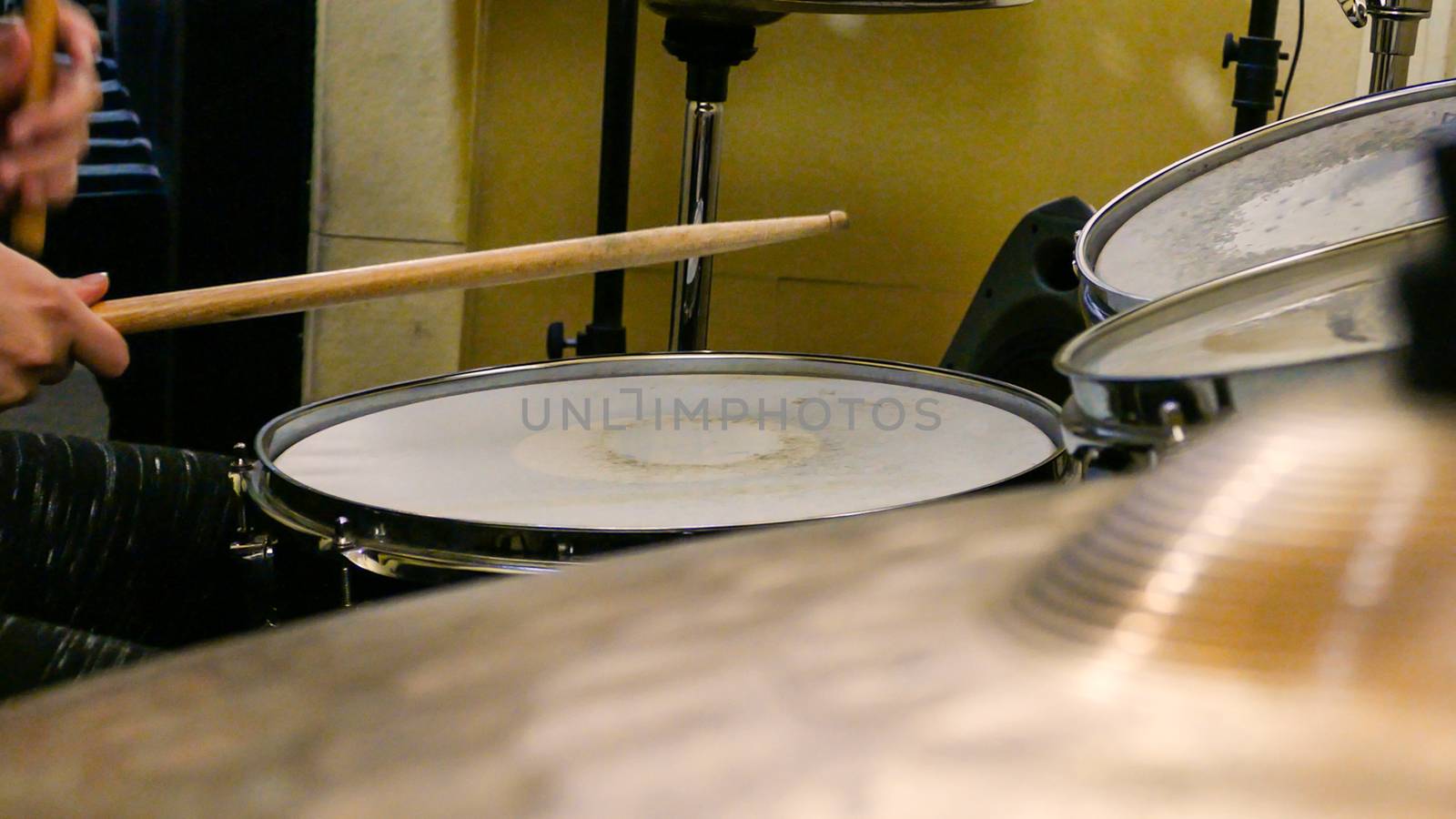 Playing drums on drum kit by imagesbykenny