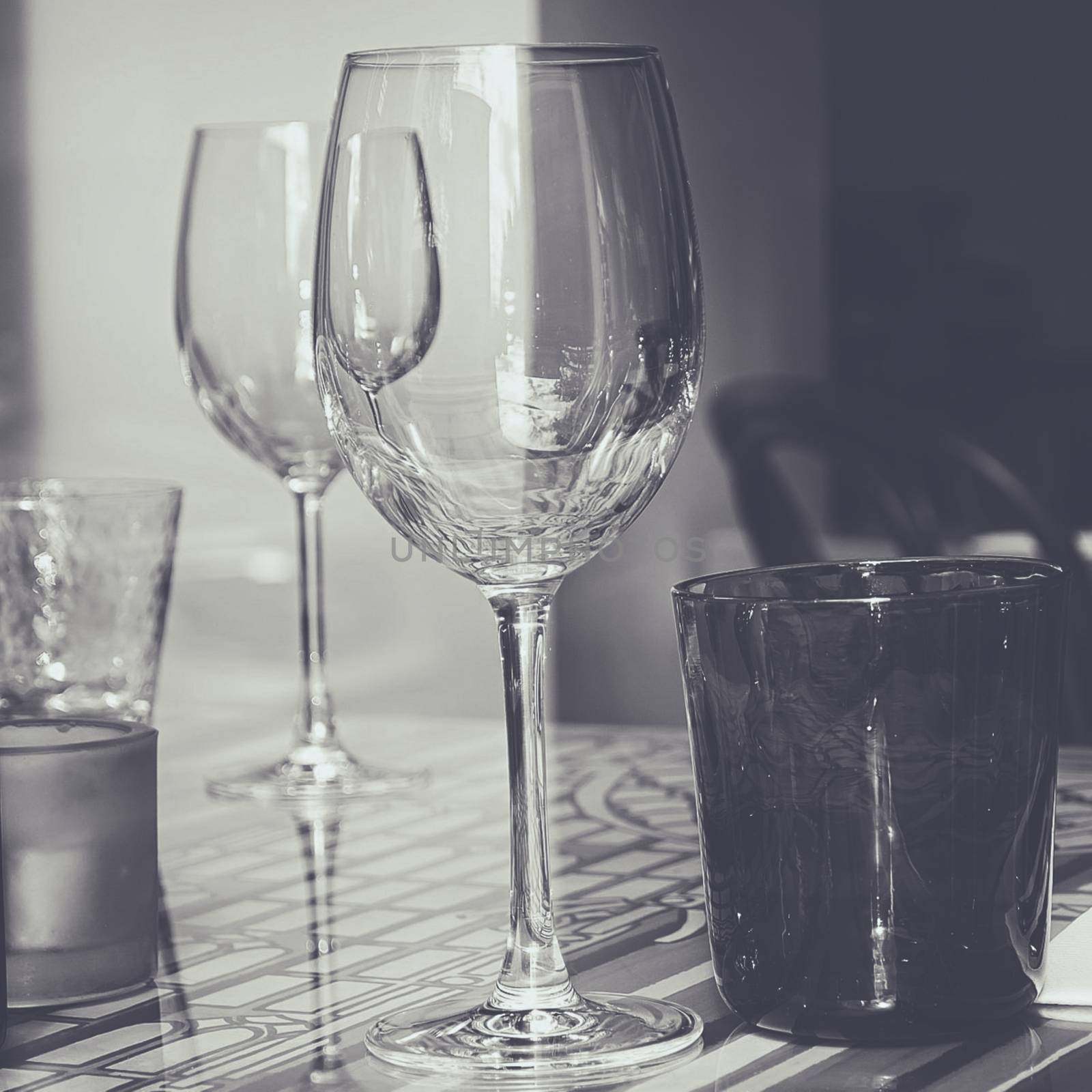 Crystal glasses on decorated glass table by balage941