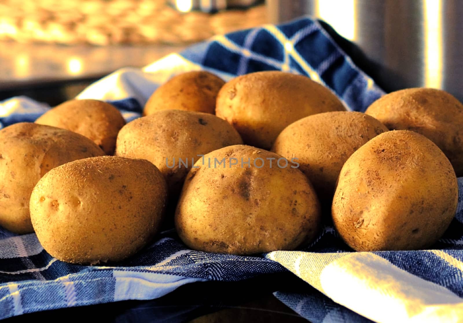 Potatoes on the blue kitchen towel by balage941