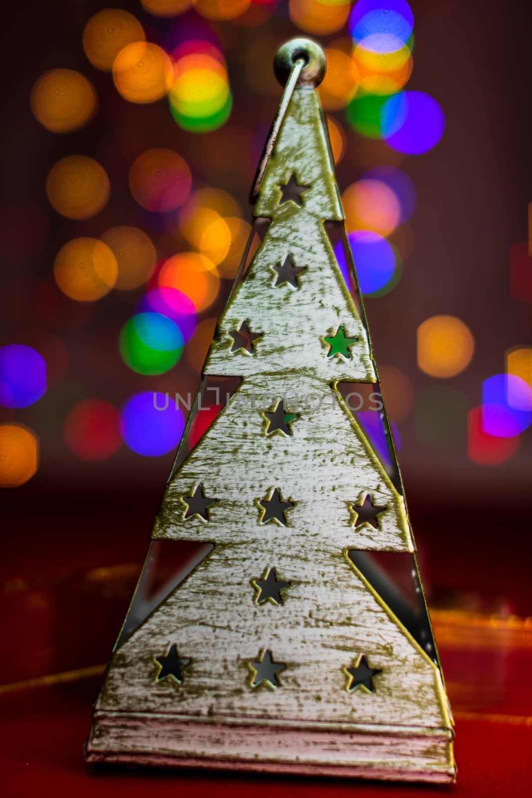 Christmas tree decoration ornament isolated on blurred background of  lights