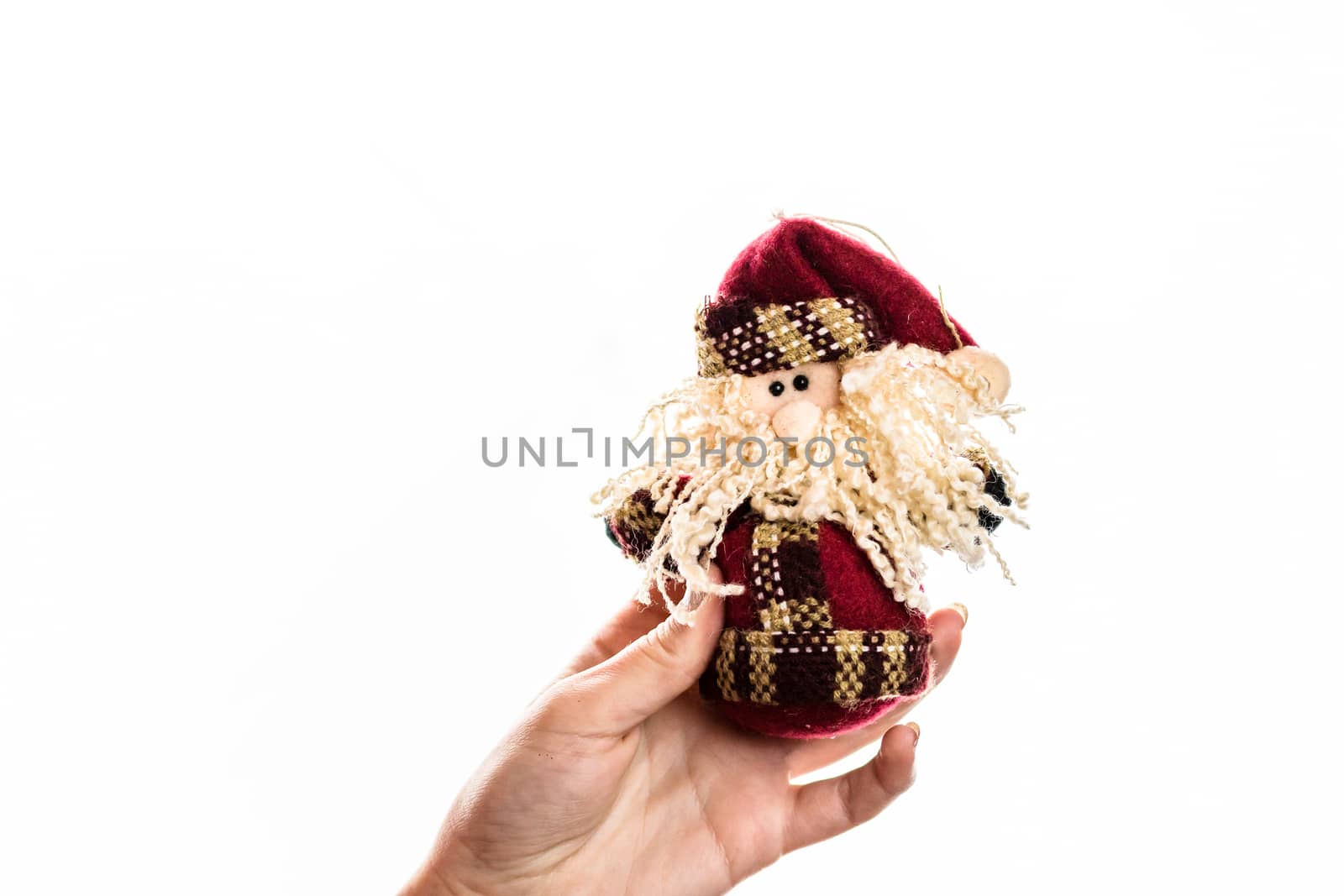 Hand holding showing giving or receiving Christmas decoration isolated on white background
