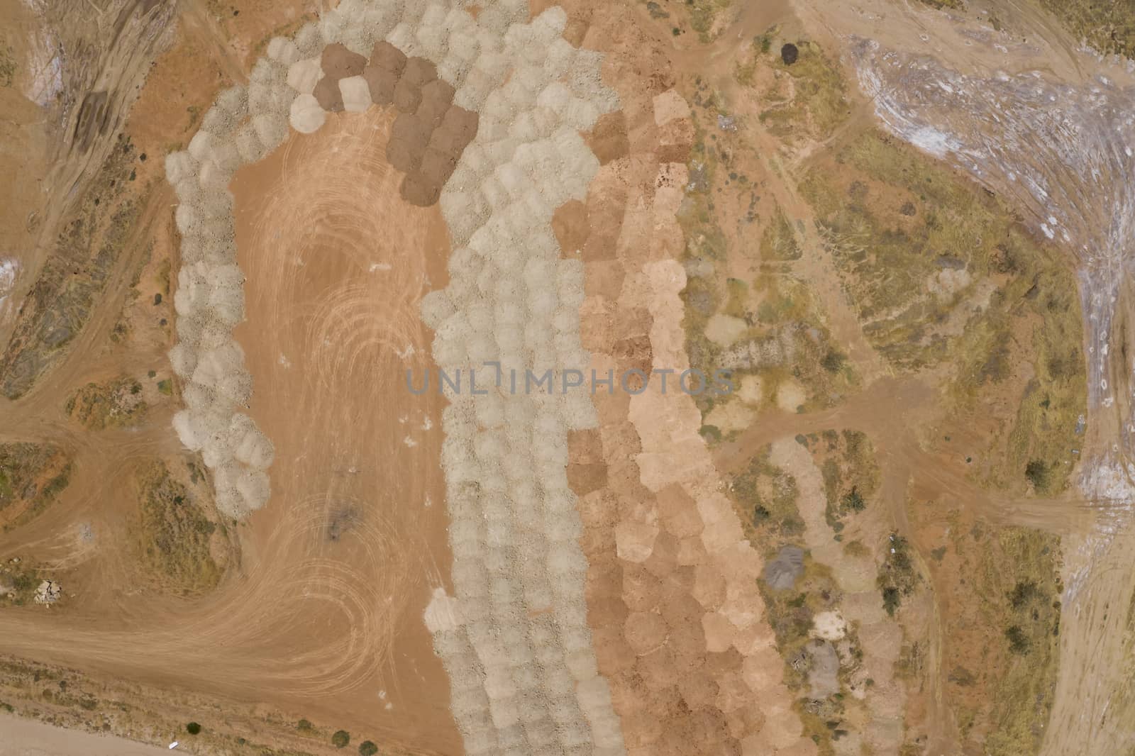 Aerial view of sand patterns in a dry river bed by WittkePhotos