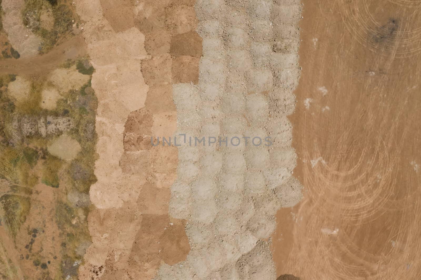 Aerial view of sand patterns in a dry river bed by WittkePhotos