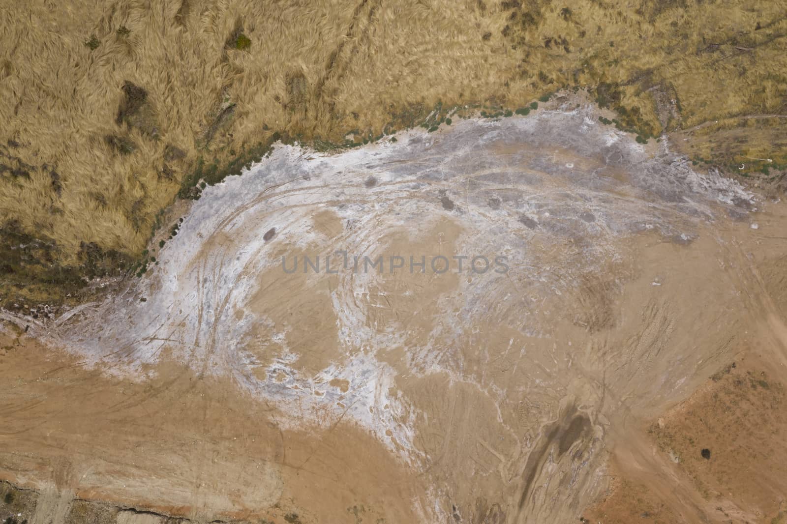 Aerial view of sand patterns in a dry river bed