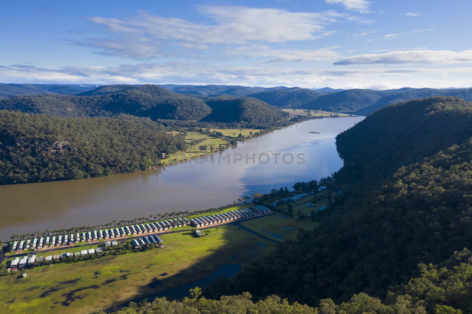 Holiday cabins along the banks of the Hawkesbury River in Australia by WittkePhotos