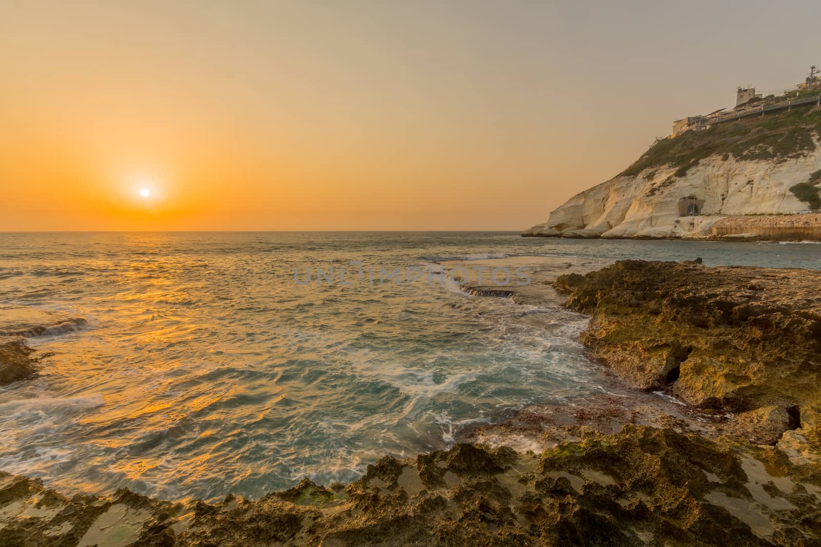 View of the sunset with the coast and cliffs of Rosh HaNikra, Northern Israel