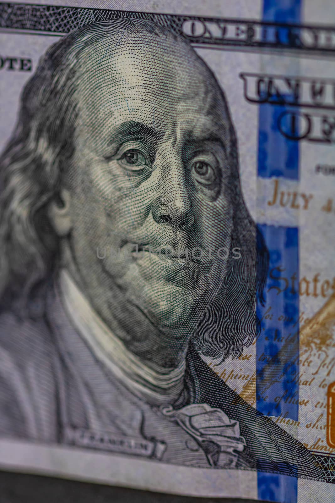 Selective focus on detail of 100 dollars banknote. Close up macro detail of money banknotes, dollars isolated. World money concept, inflation and economy concept