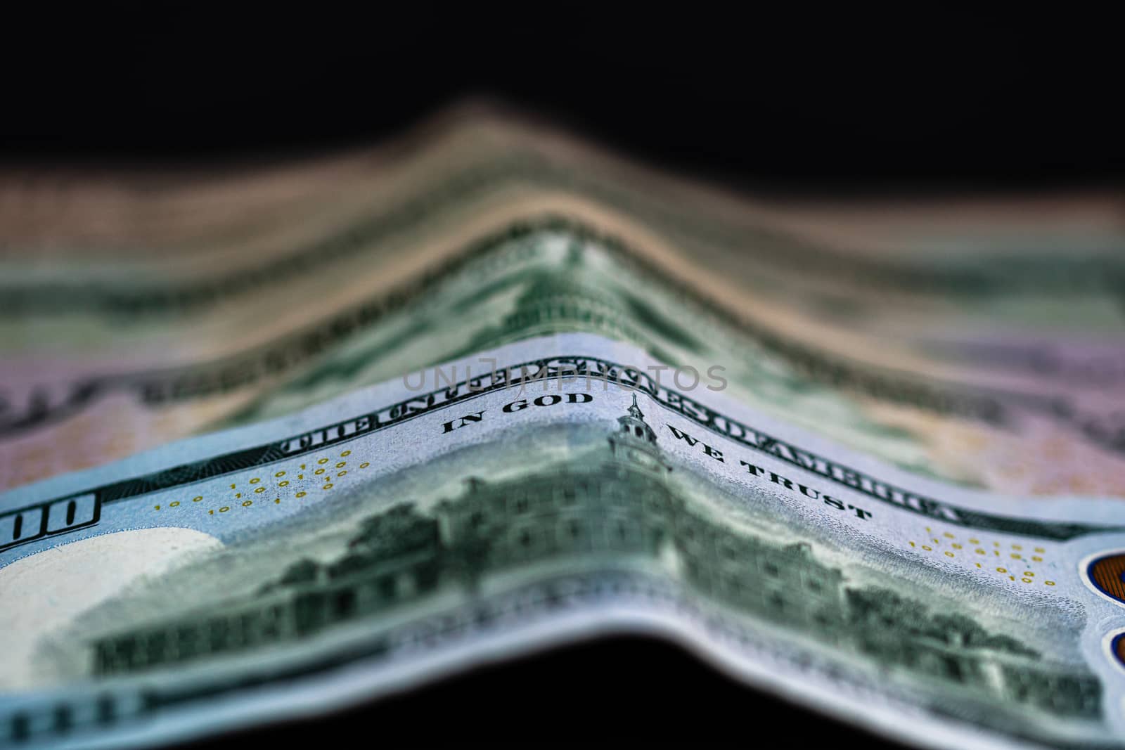 Selective focus on detail of dollars banknotes. Close up macro detail of money banknotes, dollars isolated. World money concept, inflation and economy concept