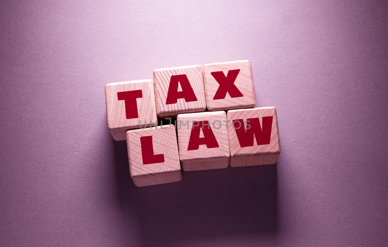 Tax Law Word with Wooden Cubes by Jievani