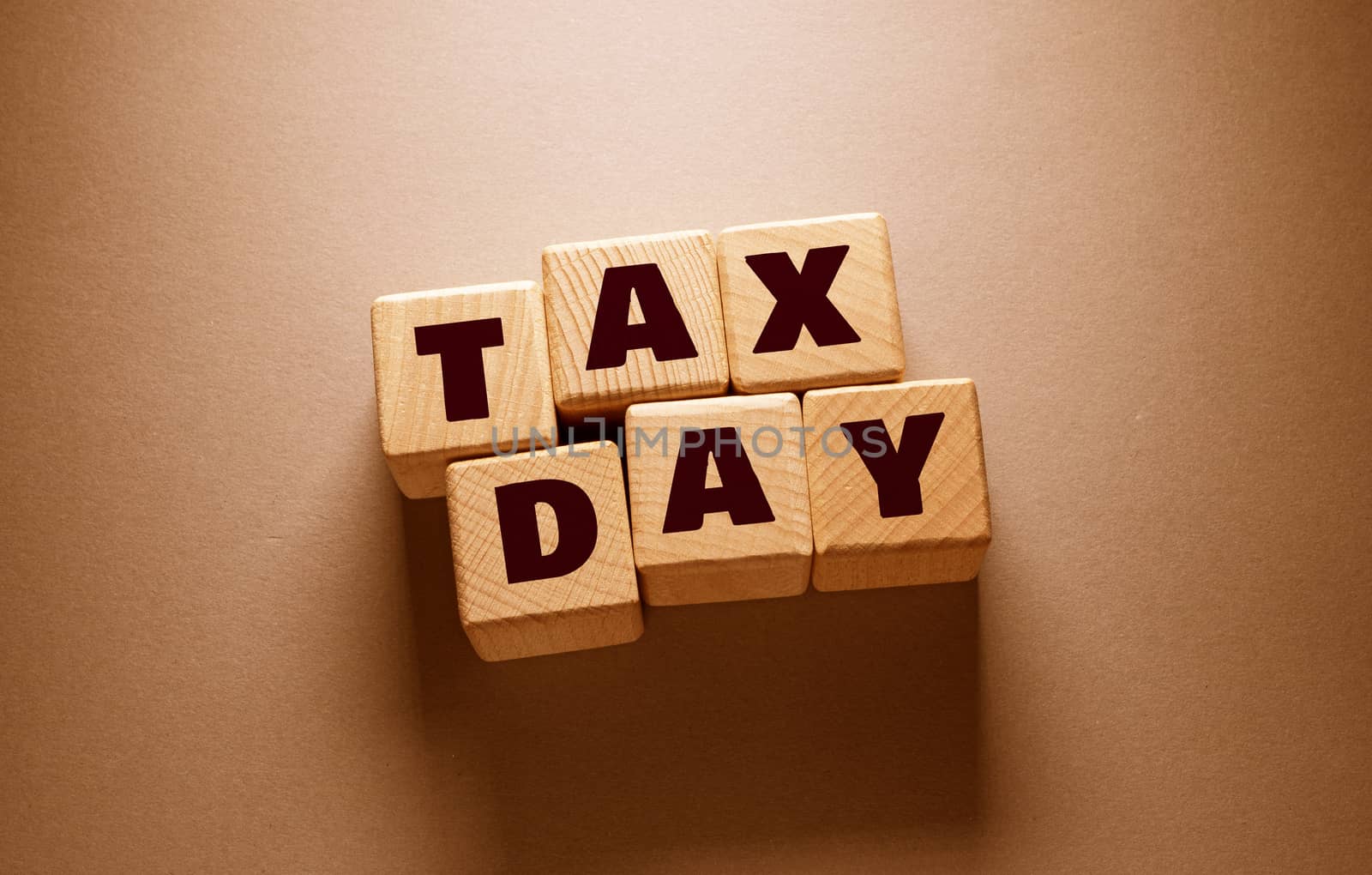 Tax Day Word with Wooden Cubes by Jievani