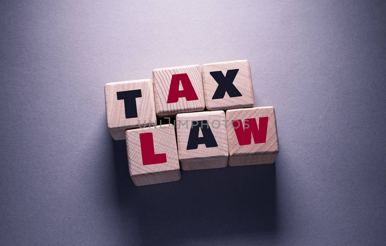 Tax Law Word with Wooden Cubes by Jievani