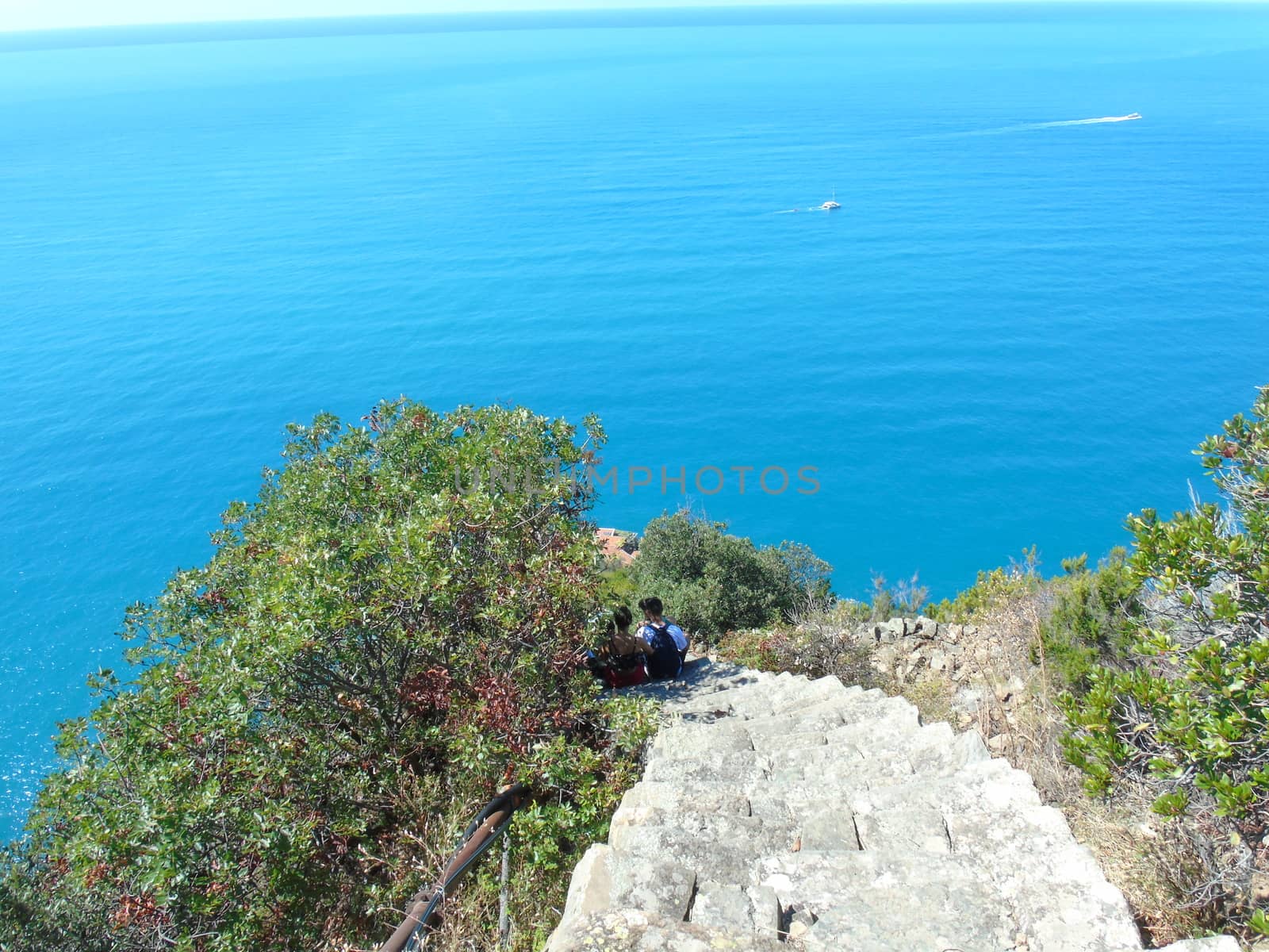 Liguria, Italy - 09/01/2020: Steep stairway overlooking the sea leading to the town of Monesteroli, in Liguria.