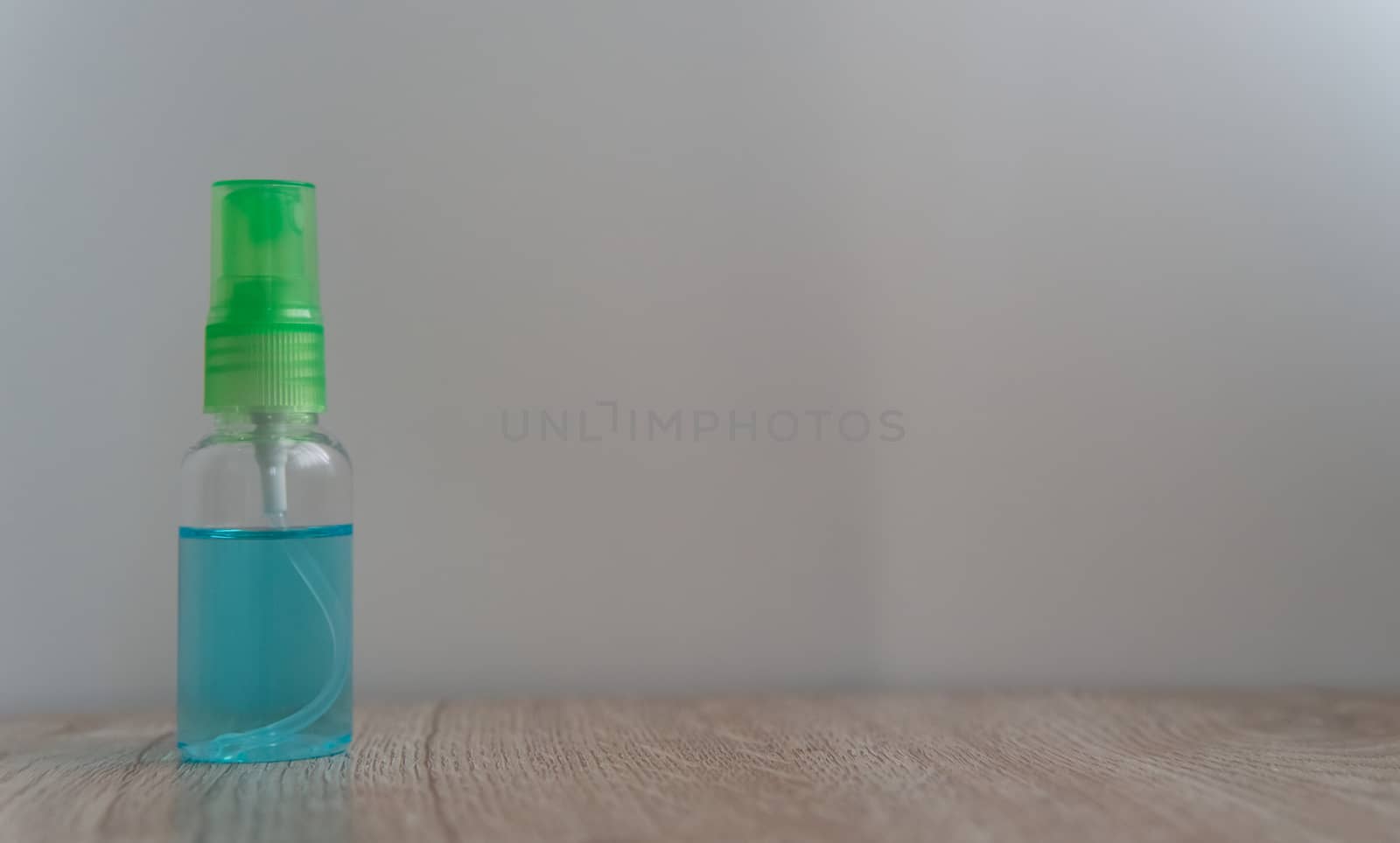 alcohol sanitizer bottle on table