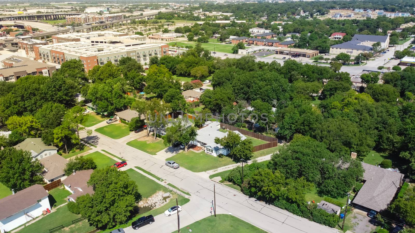 Top view green residential area outside historic downtown Carrollton, Texas by trongnguyen