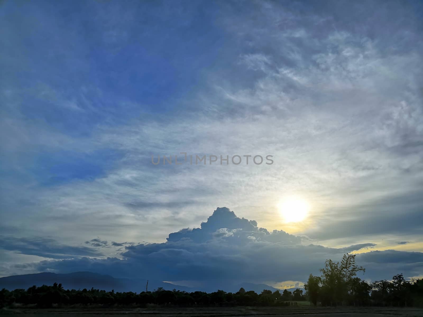 Cloud shaped like mountains and sunset